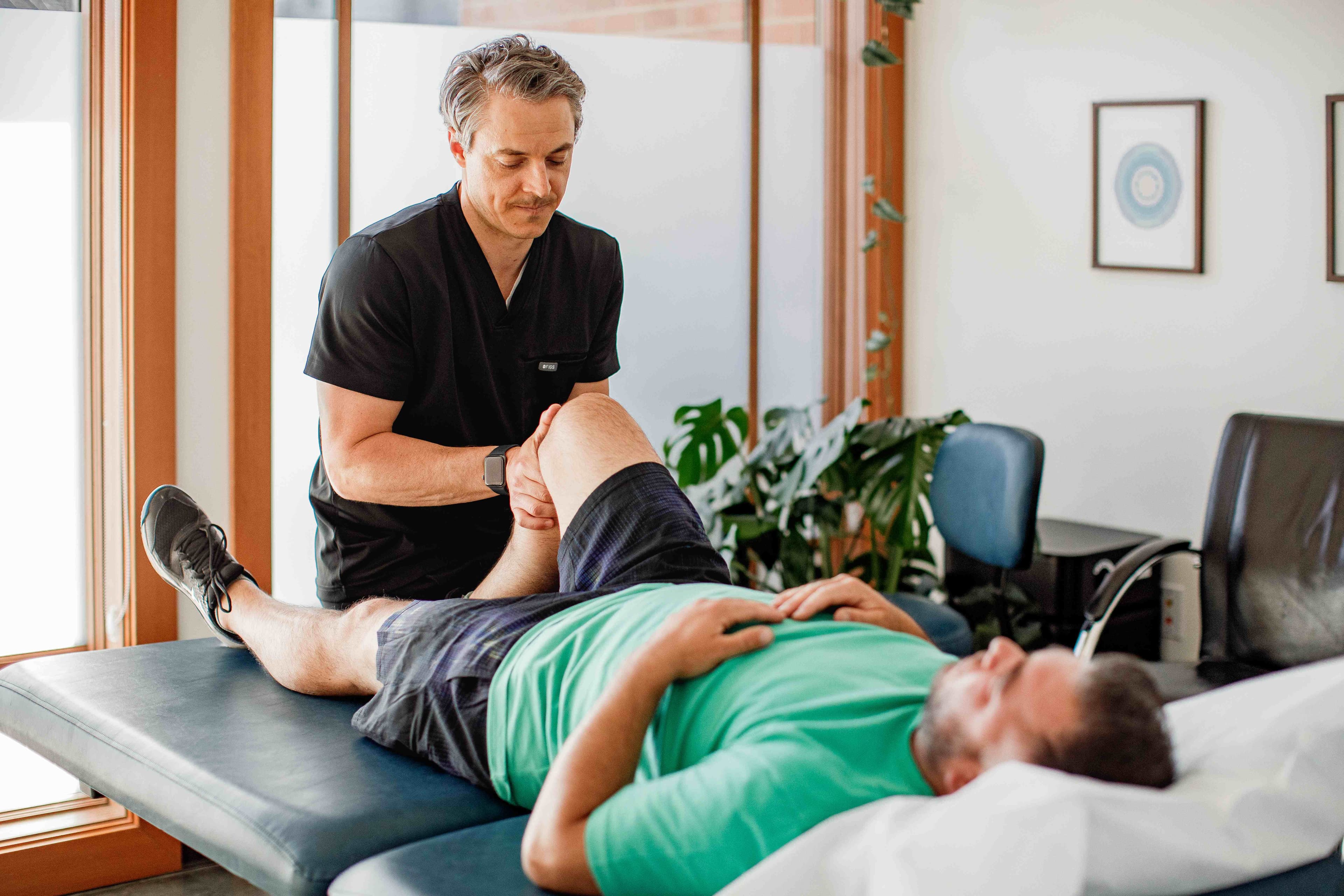 Dr. Borys in consultation with a patient discussing a whole-person treatment plan